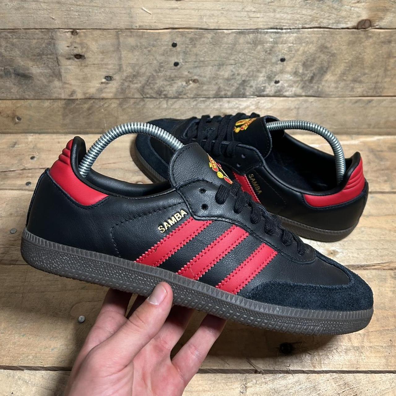 Black adidas with red stripes best sale