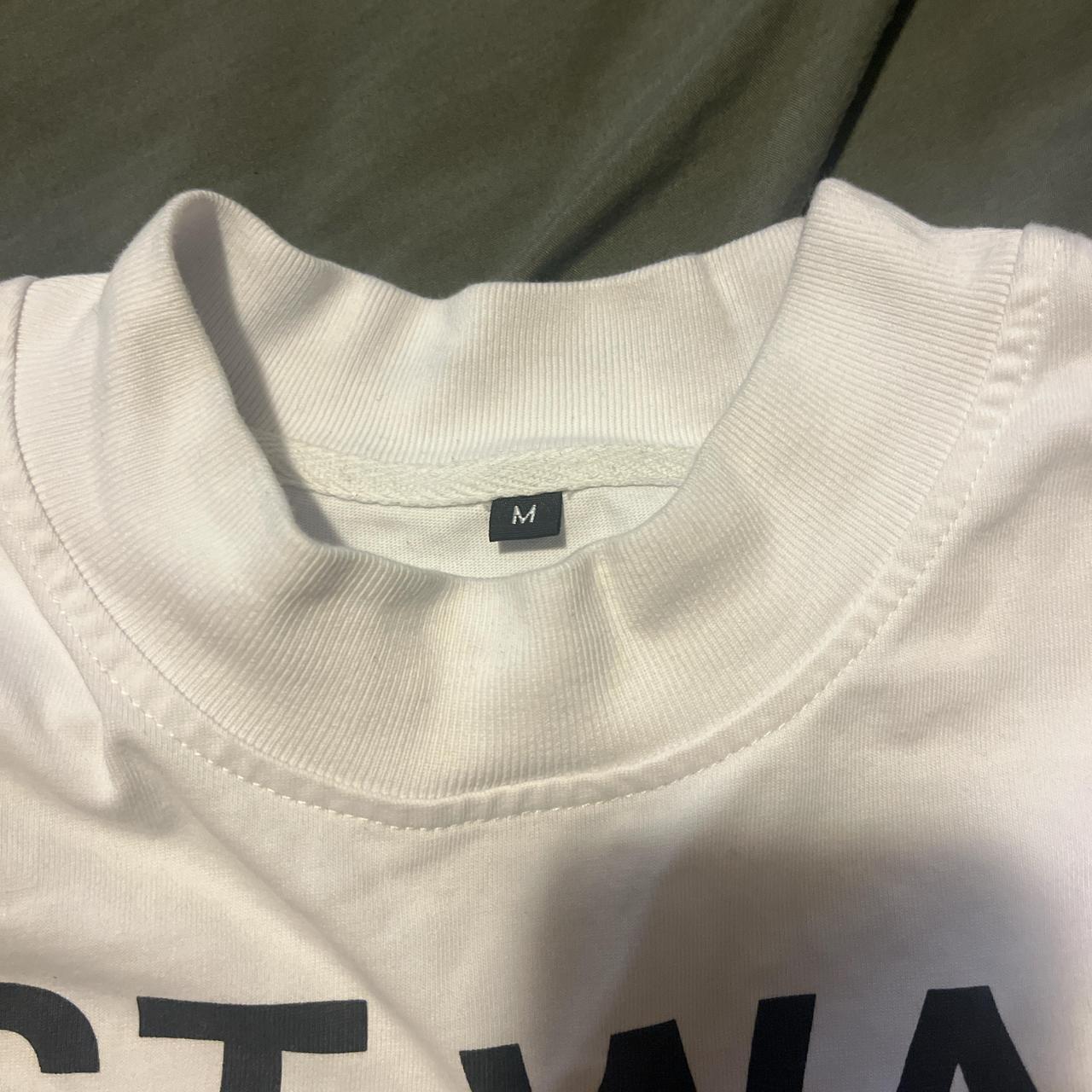 most wanted tee worn once medium but fits like a... - Depop