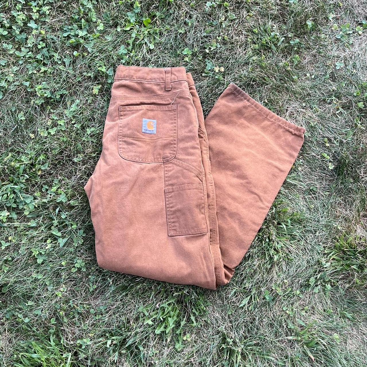 Women's Carhartt flannel lined cargo pants size 14.... Depop