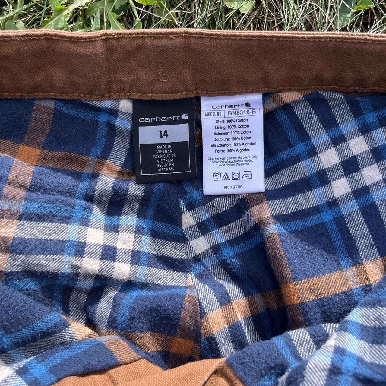 Women's Carhartt flannel lined cargo pants size 14.... Depop