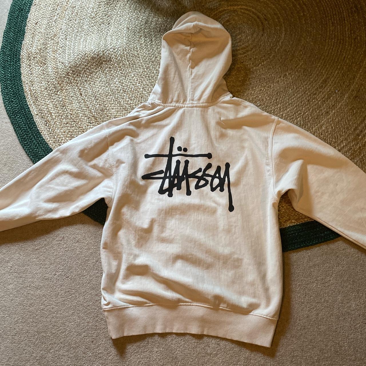 white cream stussy hoodie size L but would fit an... - Depop