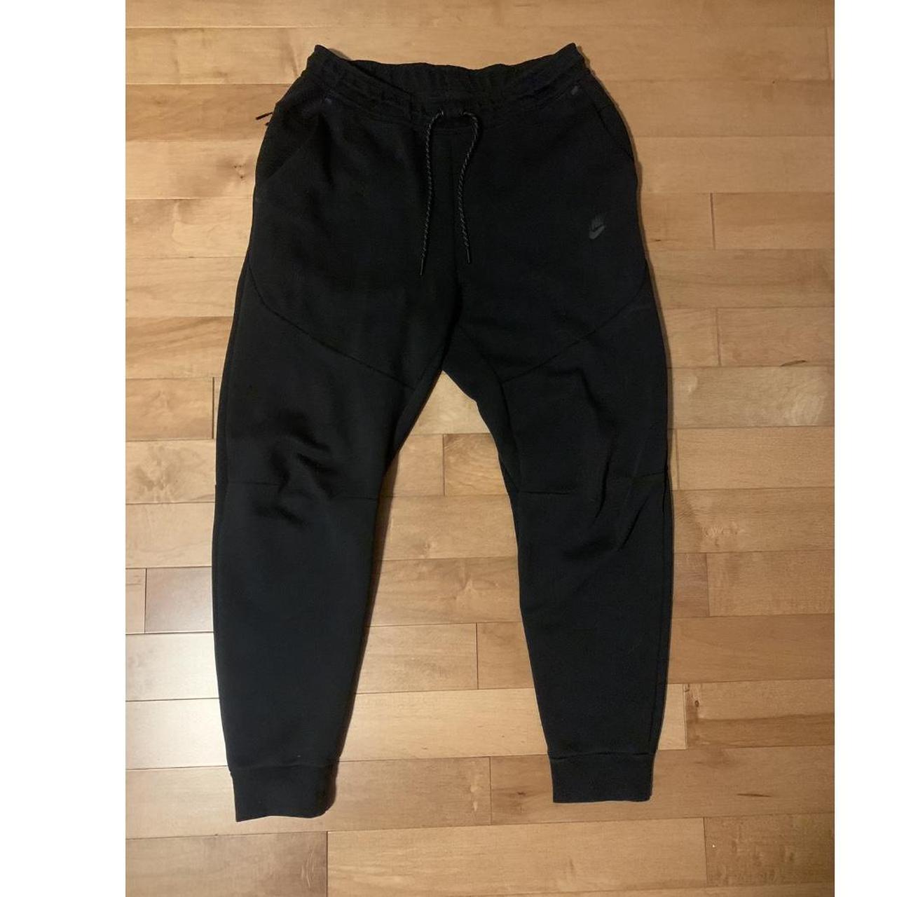 Black Nike Tech sweatpants size medium. Pants are in... Depop