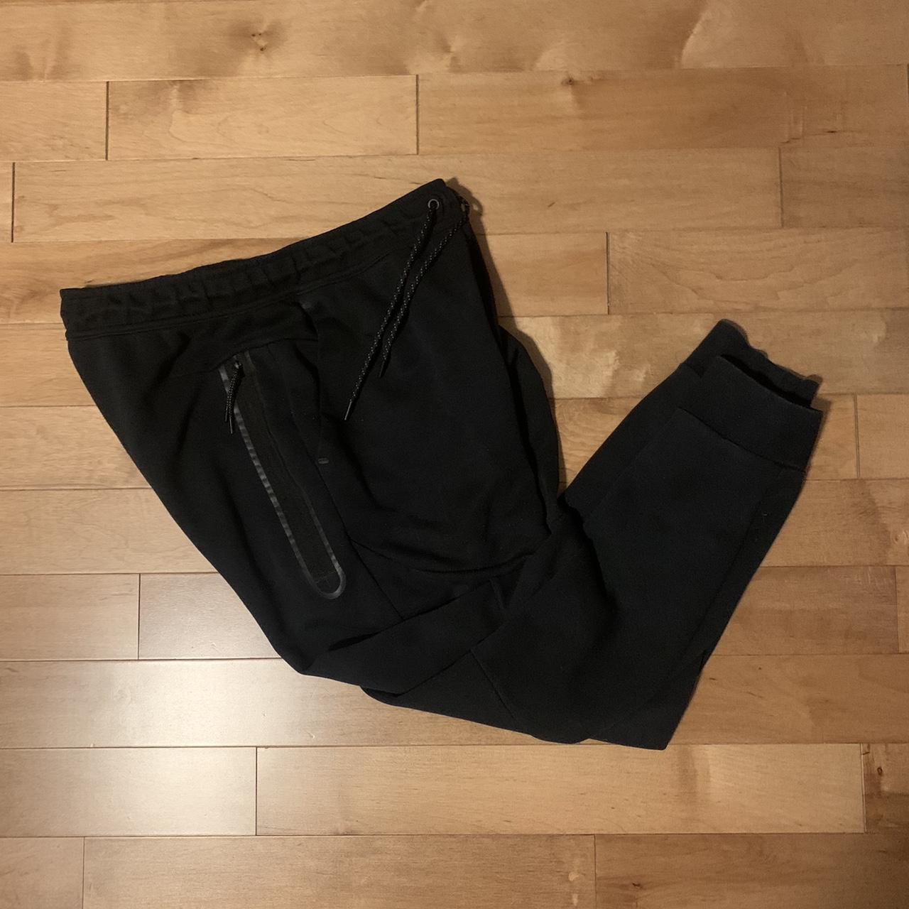 Black Nike Tech sweatpants size medium. Pants are in... Depop
