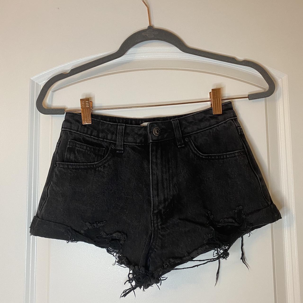 Black ripped denim shorts. Cute and flattering and