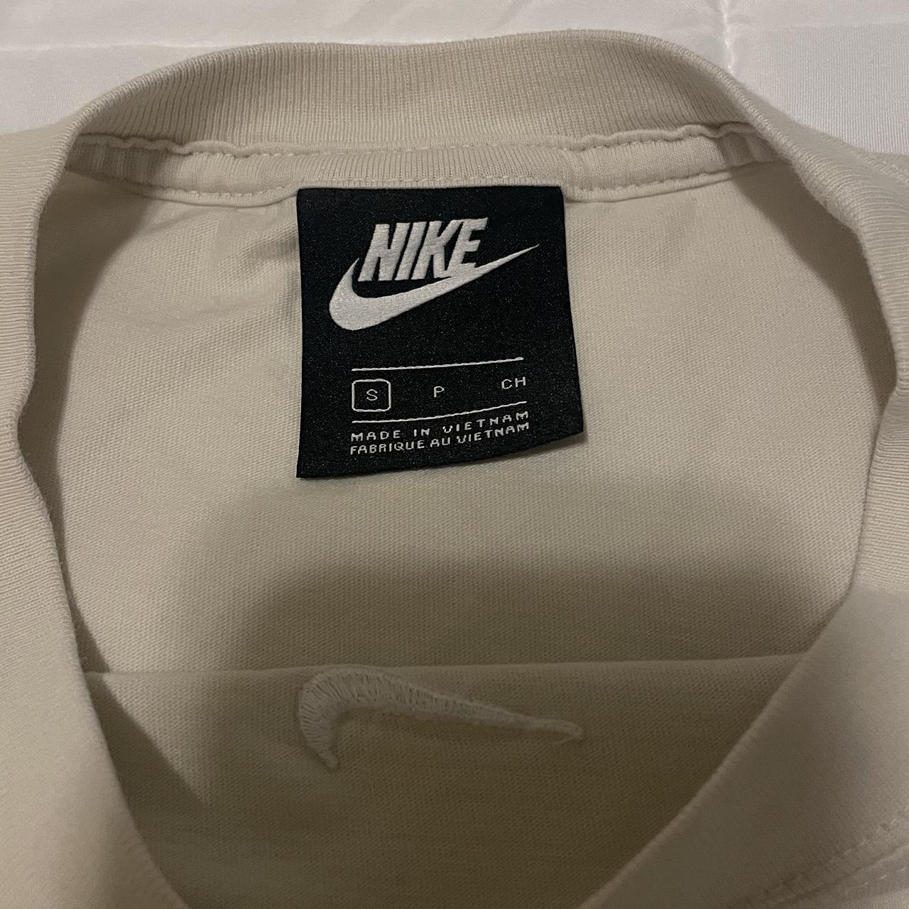 cream nike top