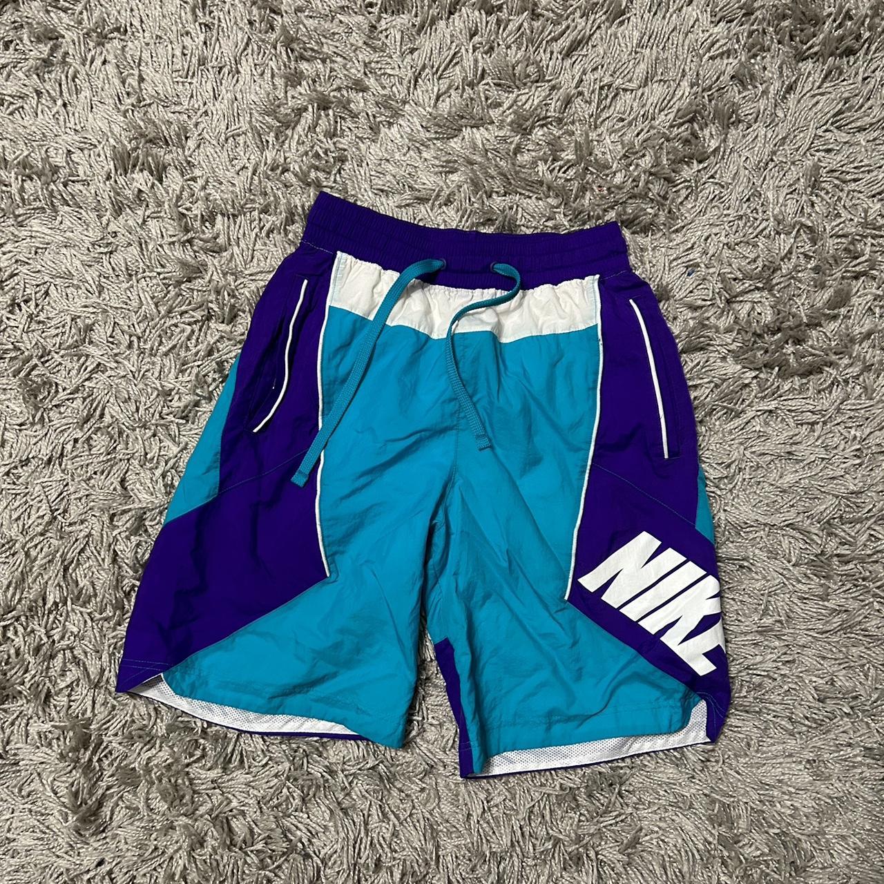 teal and purple nike shorts