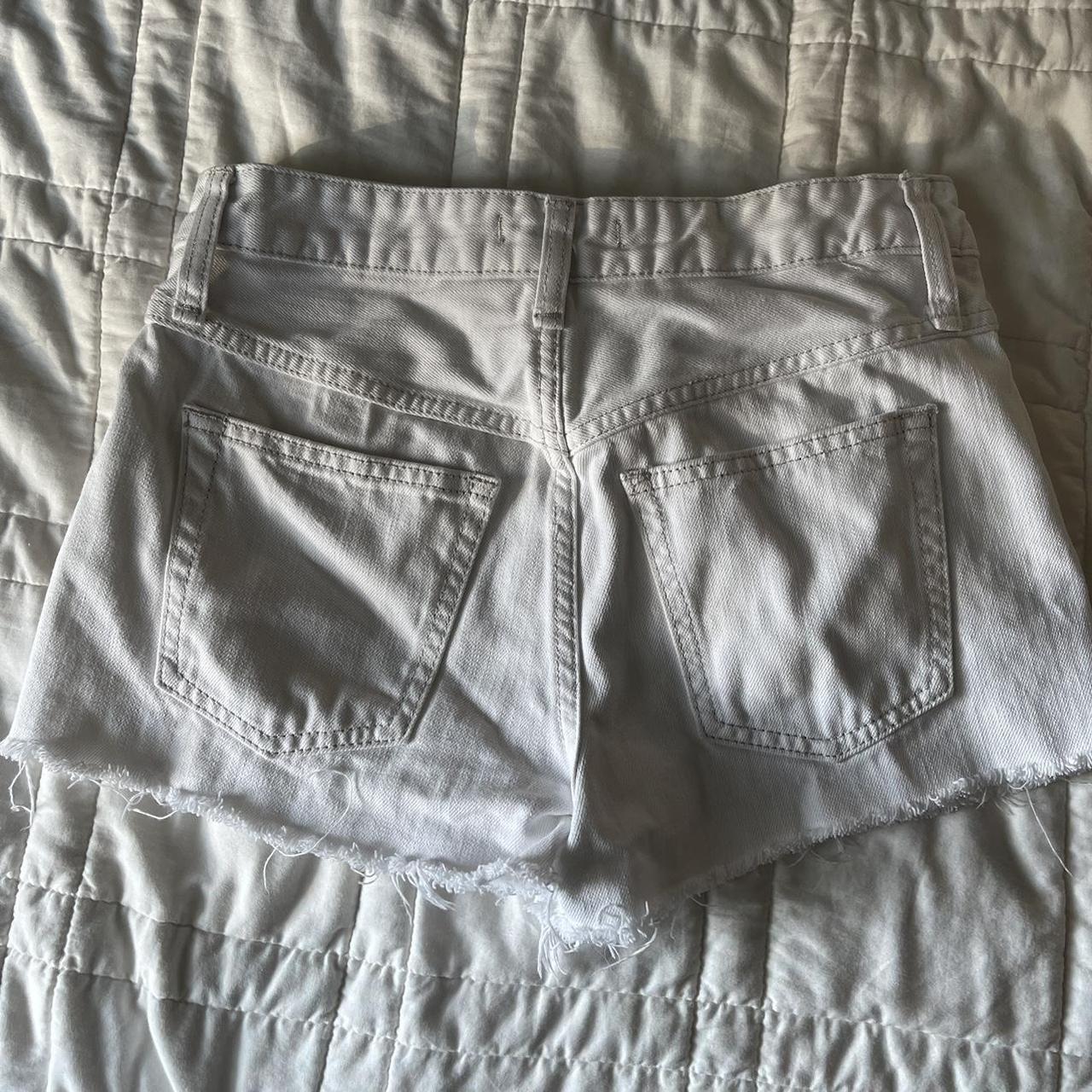 White jean shorts by Free People. Great... Depop
