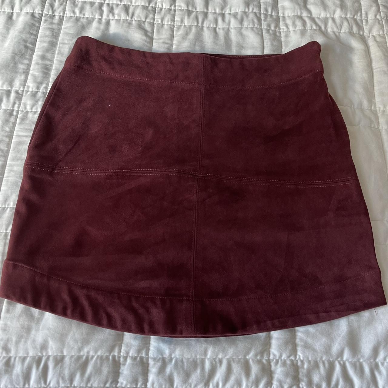 Burgundy mini skirt. Faux suede material has a nice... - Depop