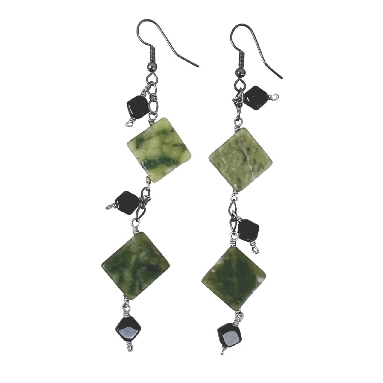 These Serpentine Green Polished Stone & Black... - Depop