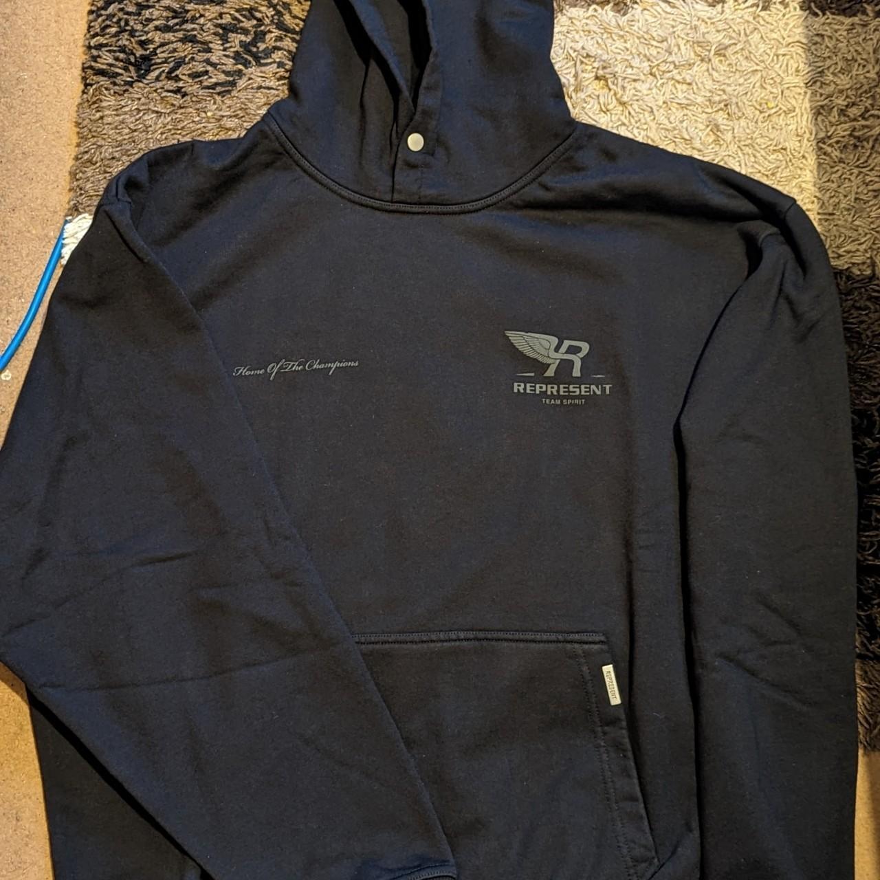 Represent TEAM SPIRIT hoodie with tags, proof