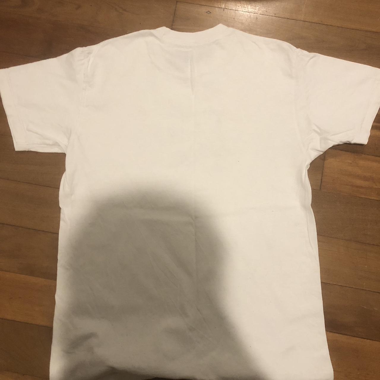 White passport T-shirt worn about three times... - Depop