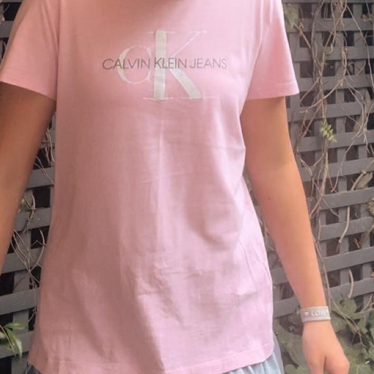 Calvin Klein pink t-shirt with white CK writing... - Depop