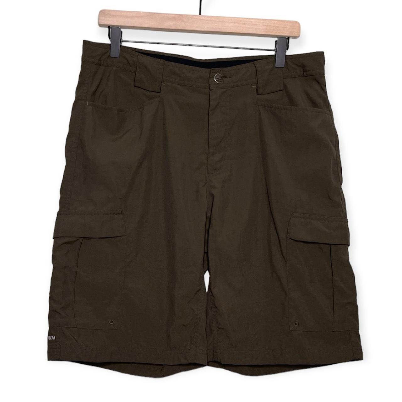 Columbia men’s titanium cargo shorts in a dark green... - Depop