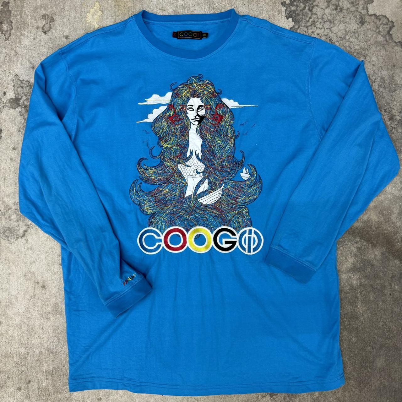 Coogi long sleeve tee. Runs big like store a 2xl and it's a long tee.