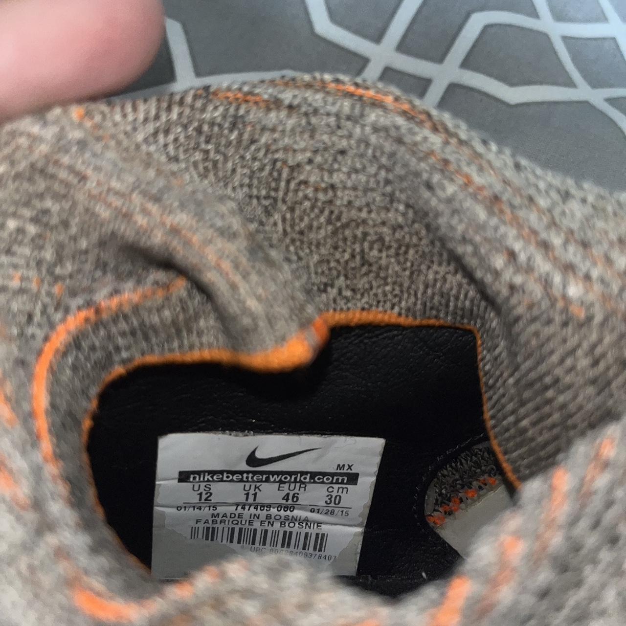 nike grey and orange football boots