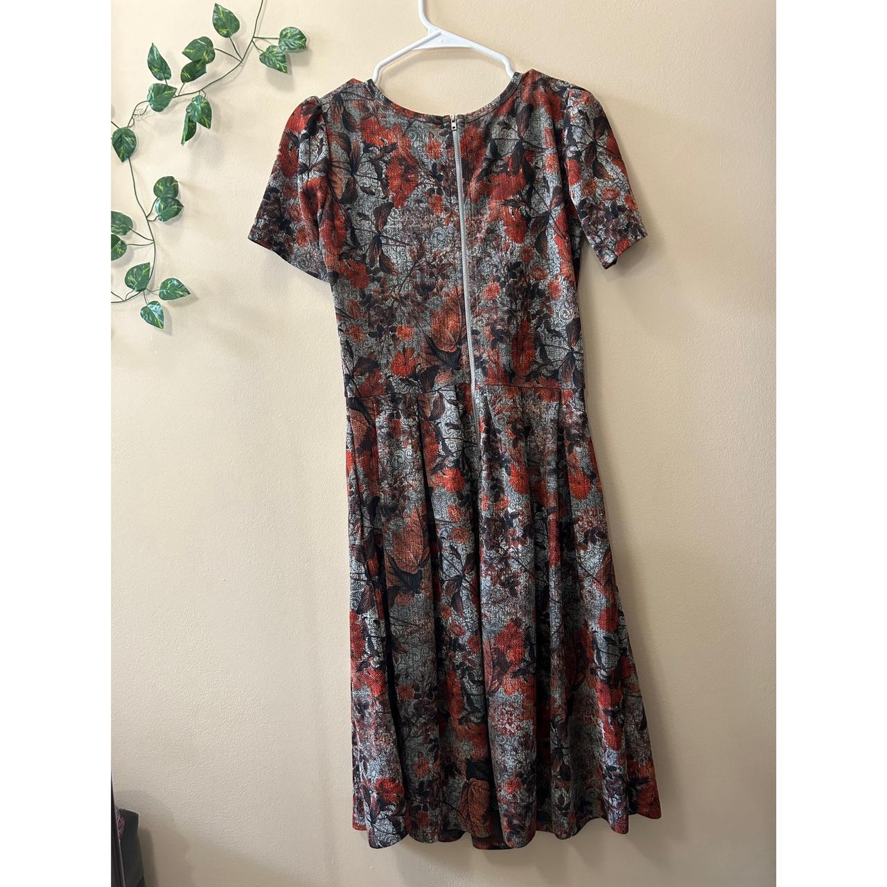 Lularose knee length floral dress with pockets.