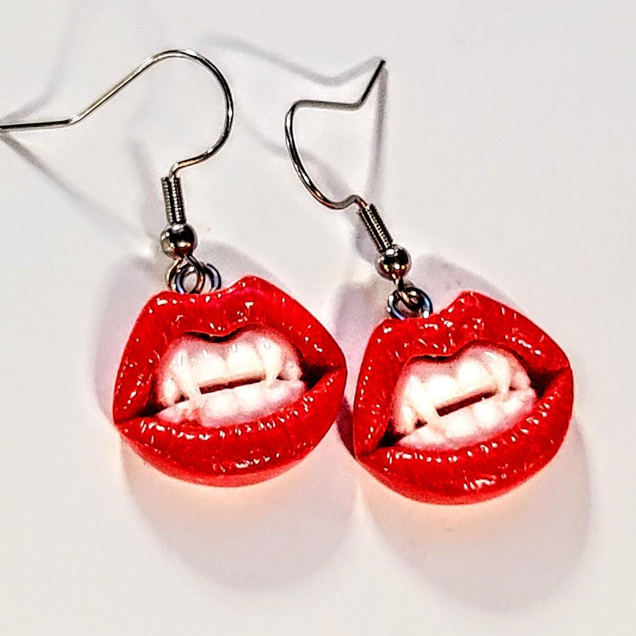 Lips with vampire teeth earrings with stainless... - Depop