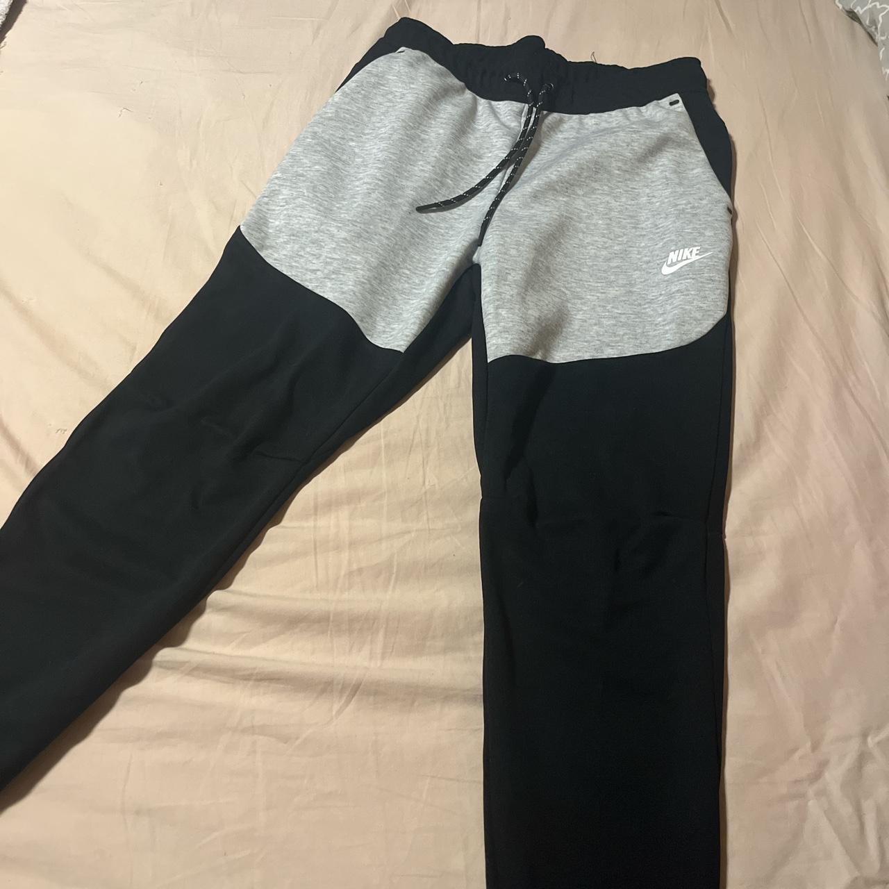 Black and Grey Nike Pants, never worn Size L, fits... Depop