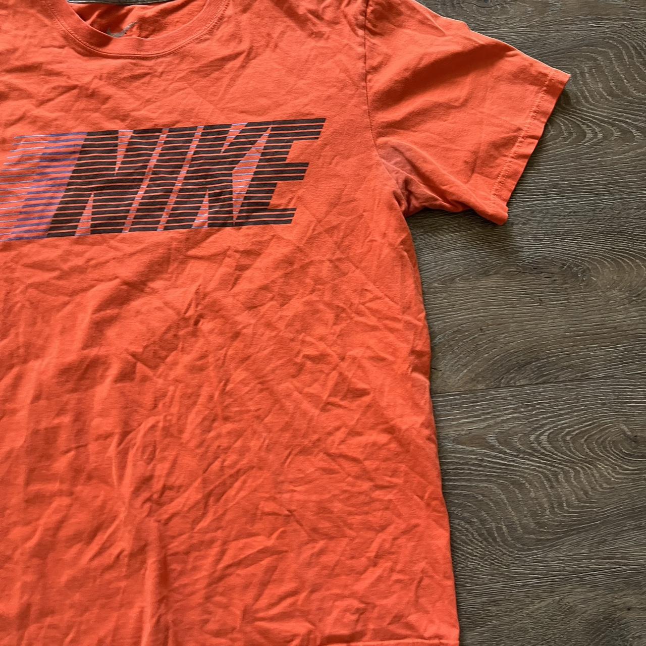 fluorescent orange nike shirt