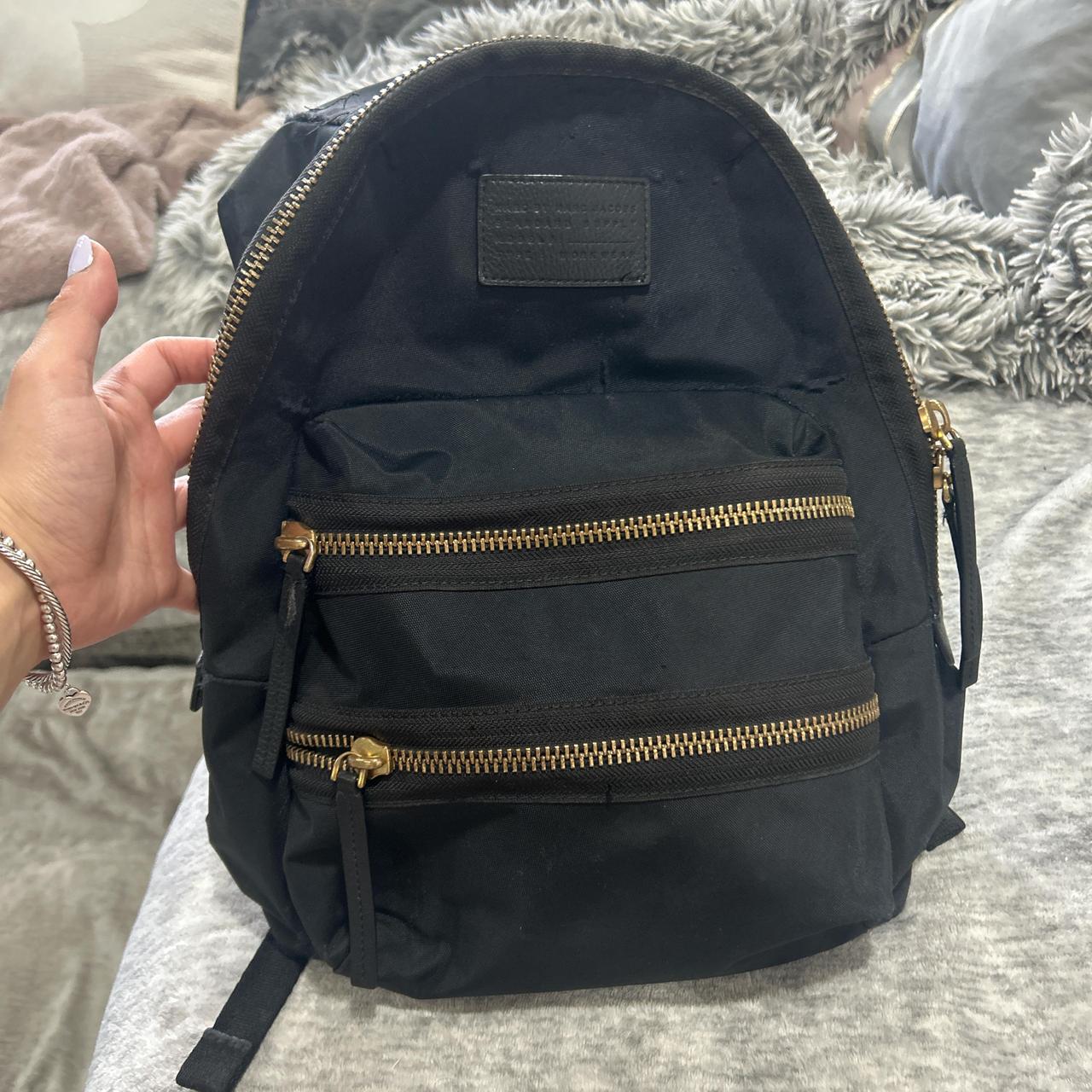 Black backpack with gold details