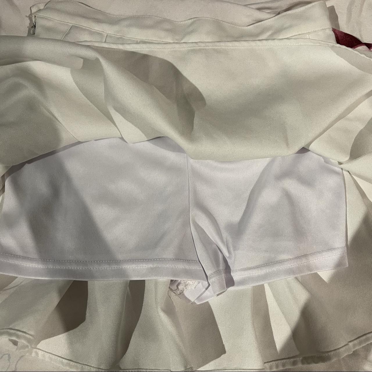 white tennis skirt, worn a few times, its got built... - Depop