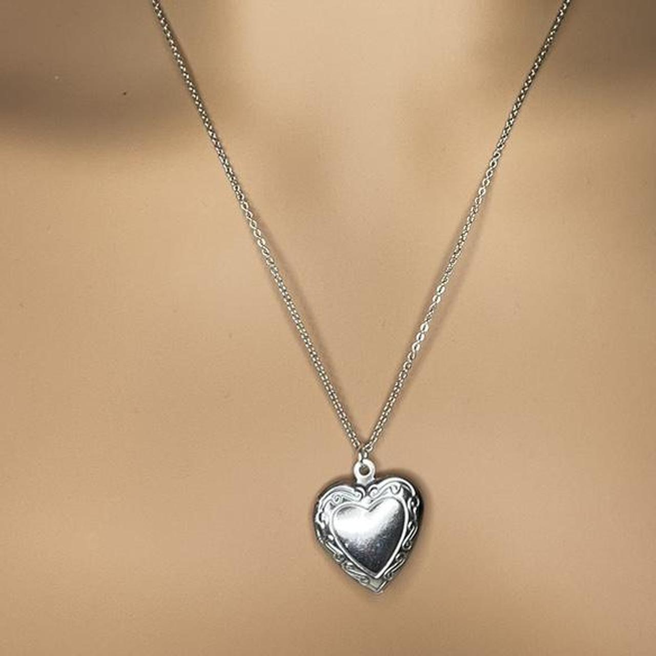 Stainless steel heart shaped locket With space for... - Depop