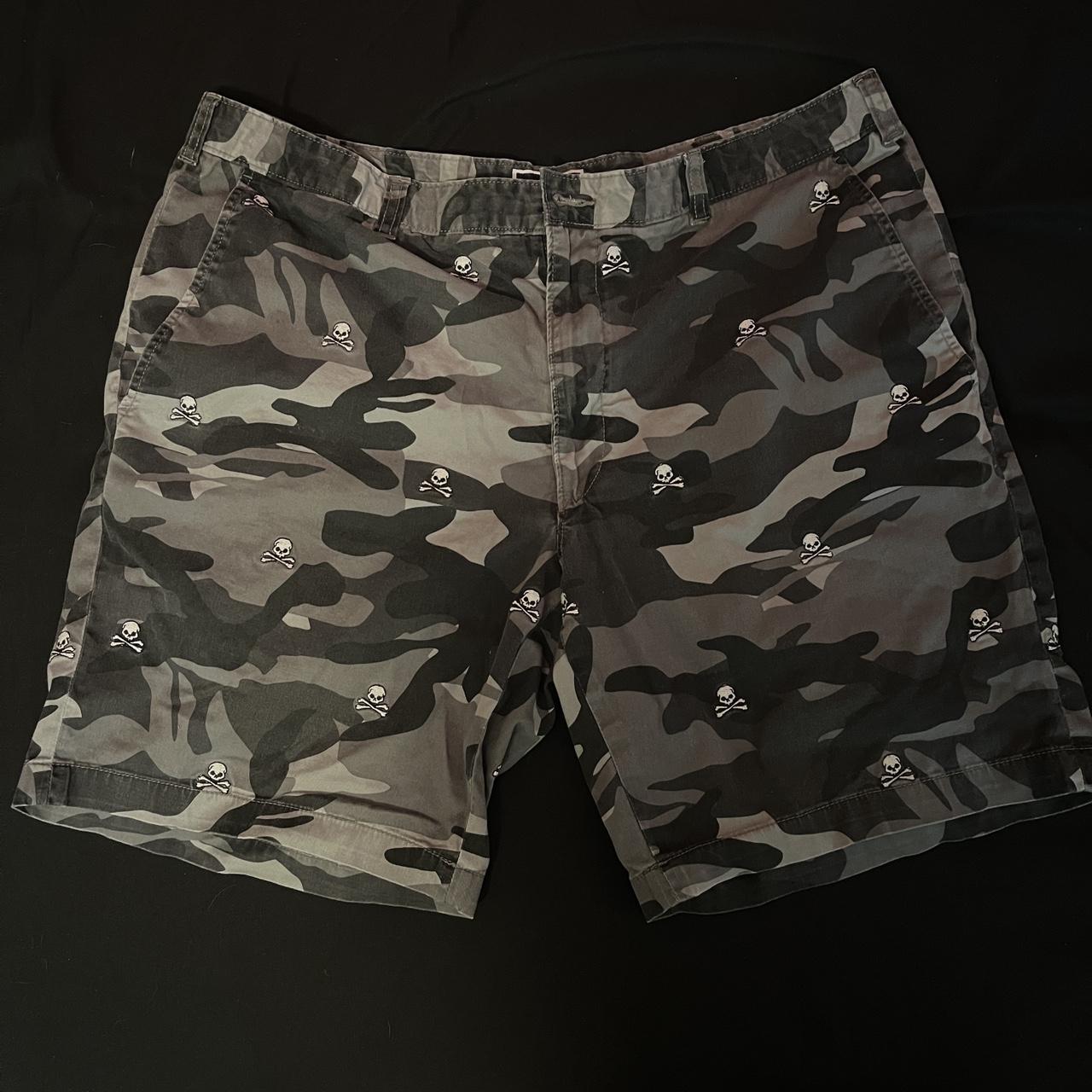 camo jorts with little skulls, width makes them... - Depop