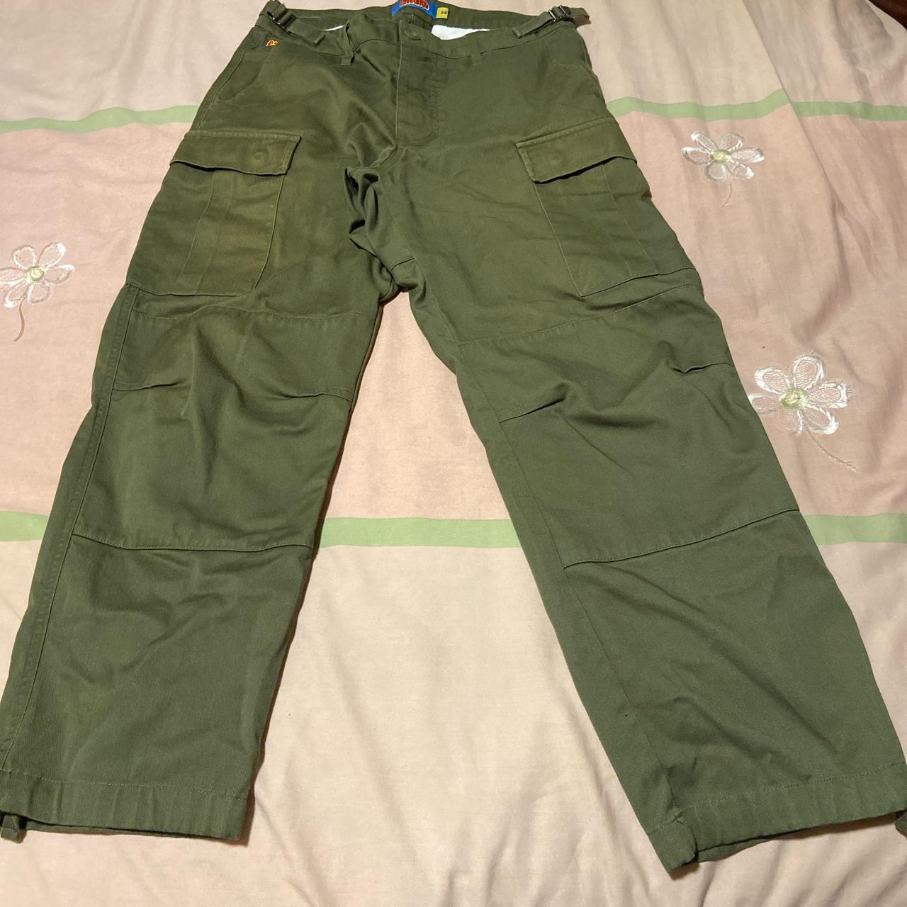 green empyre cargos size 28x29 has 3 small silver... - Depop