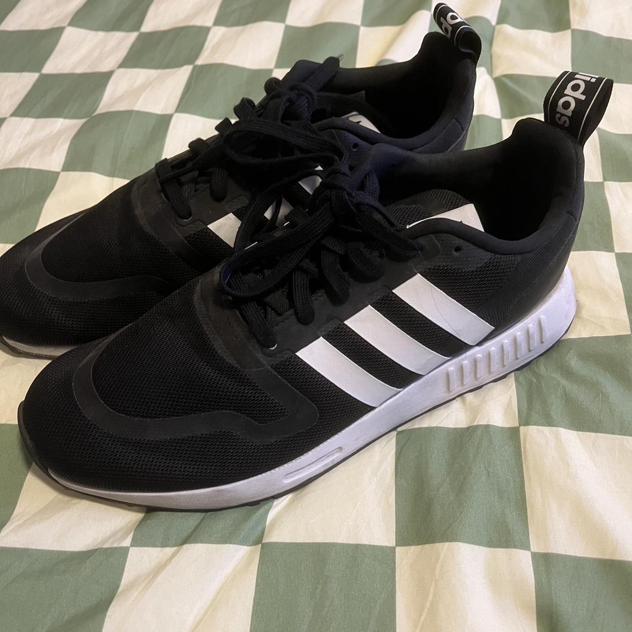 10.5 Adidas. Black with white stripes. Worn a couple