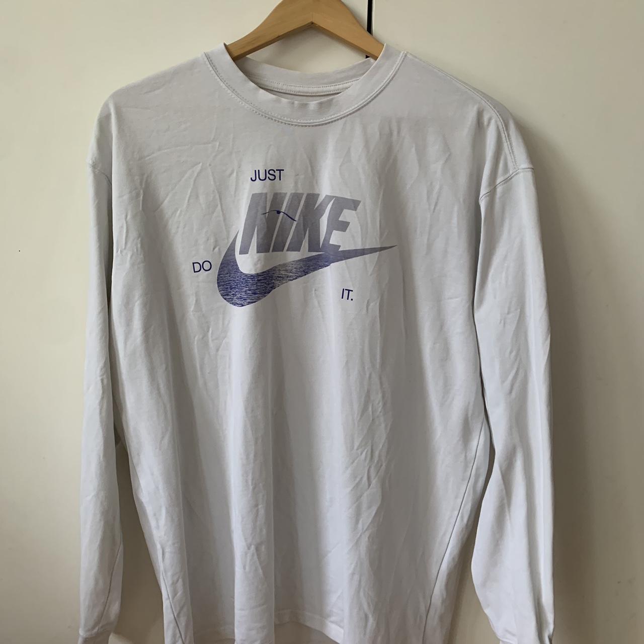 White Nike long sleeve t shirt with graphics on back... - Depop