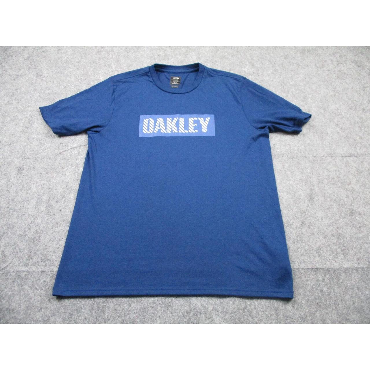 Oakley Men's Blue T-shirt | Depop