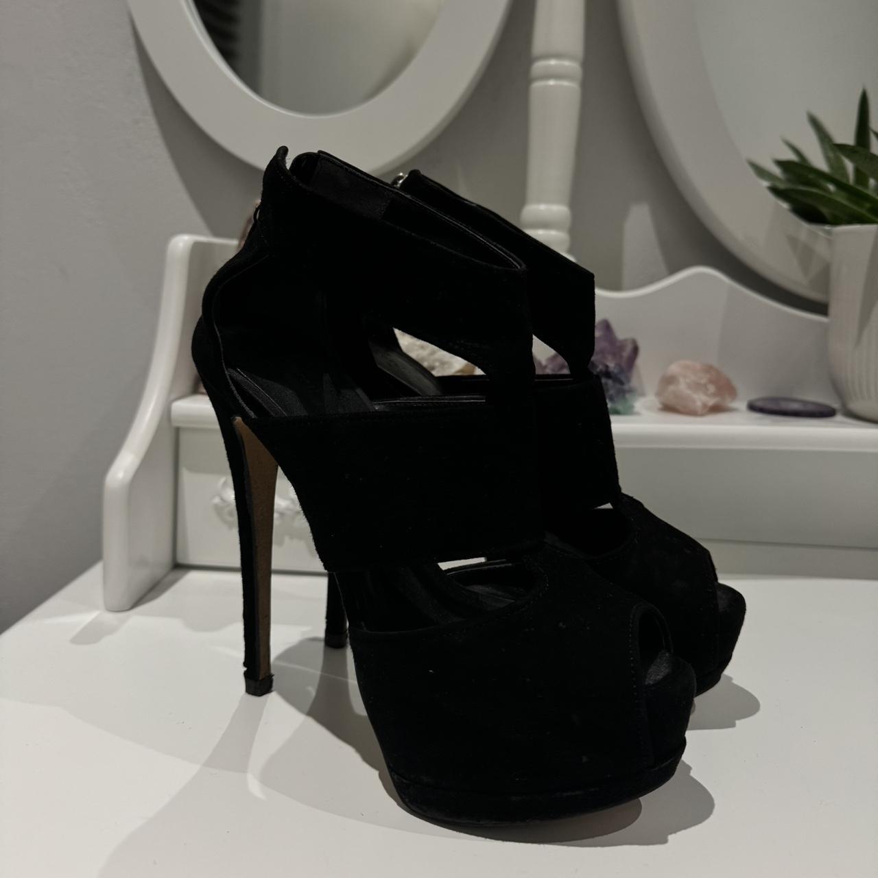 Black suede platform heels with a high heel heels