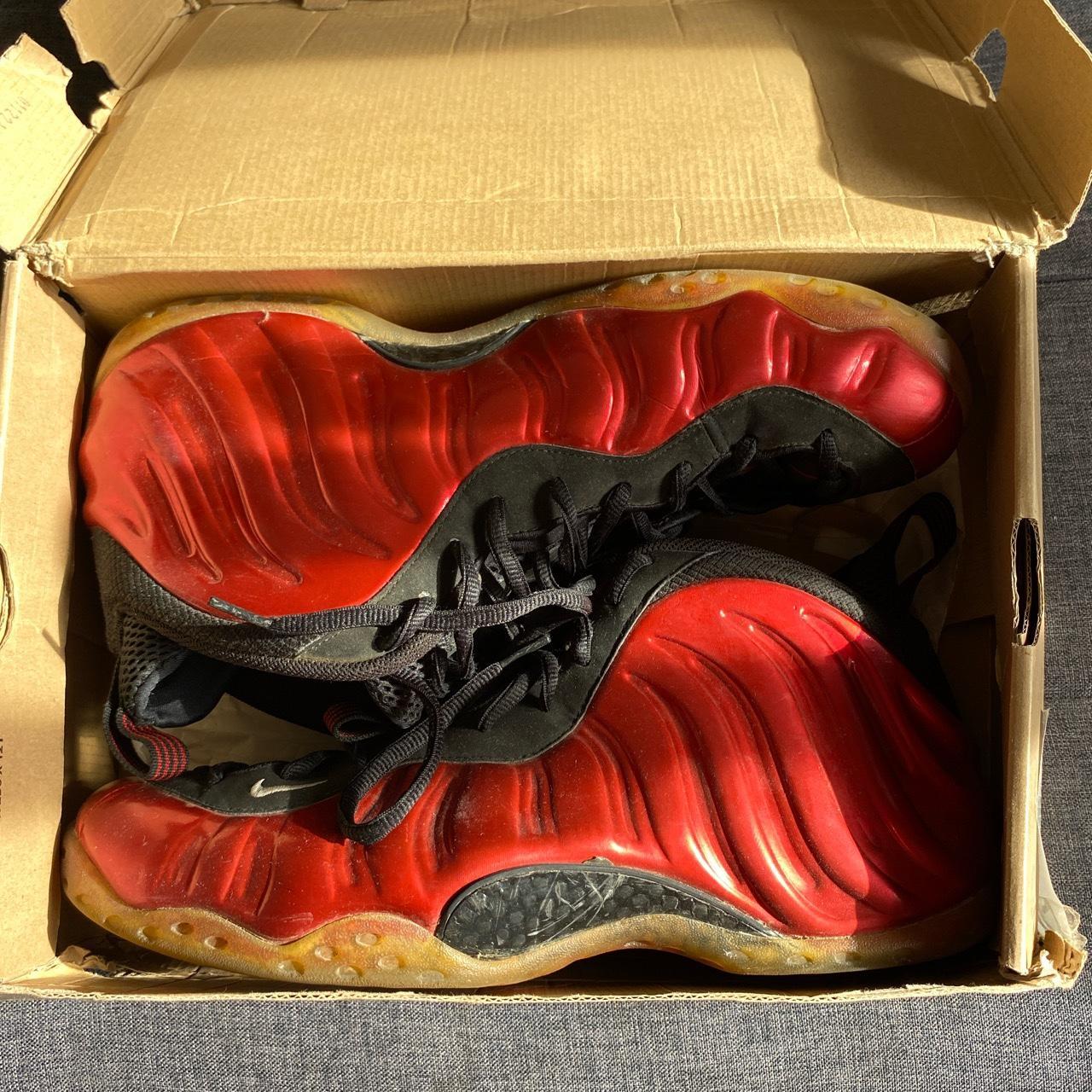 red and black nike foams