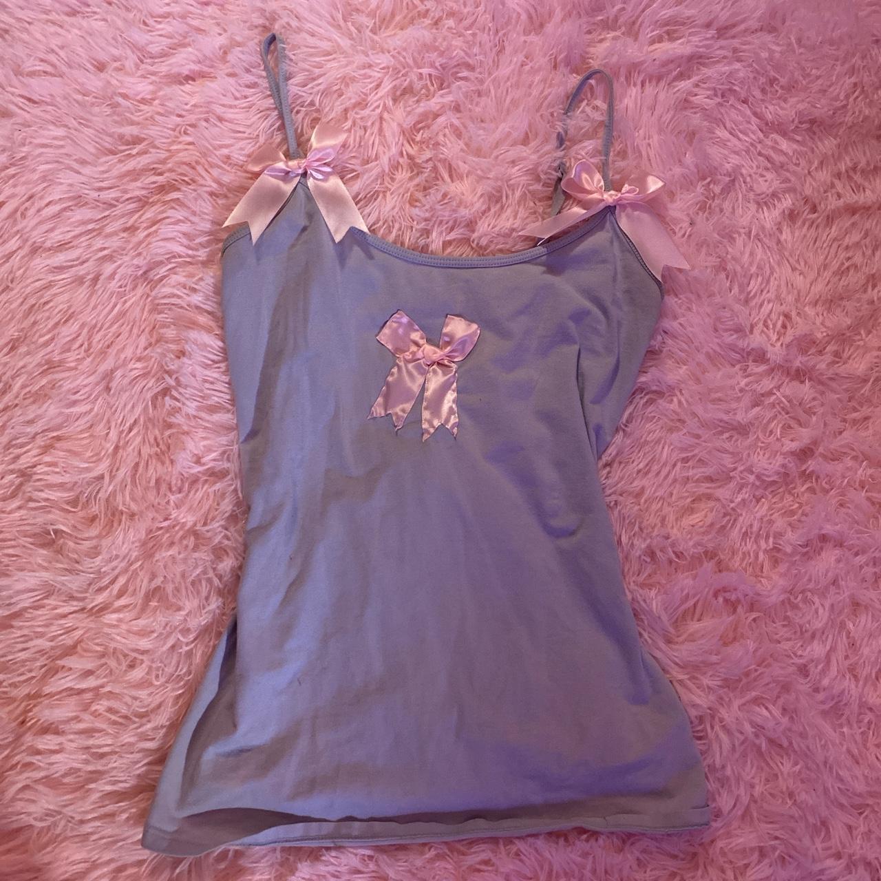 the cutest baby blue tank with baby pink bows... Depop