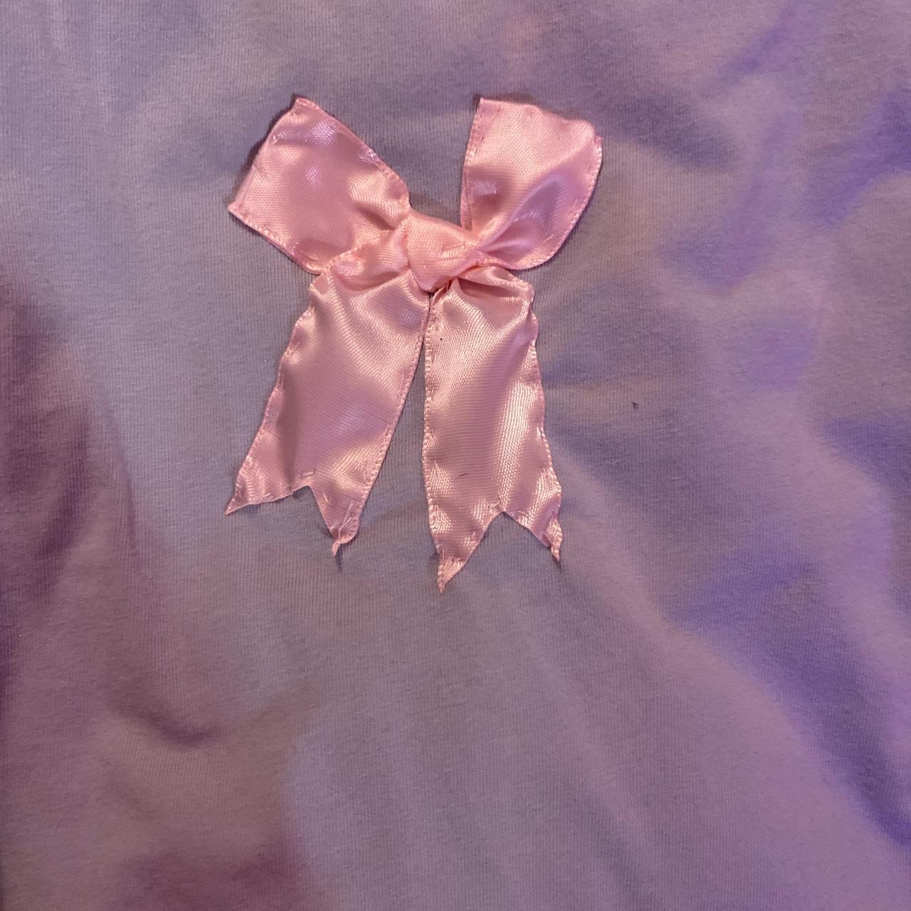 the cutest baby blue tank with baby pink bows... Depop