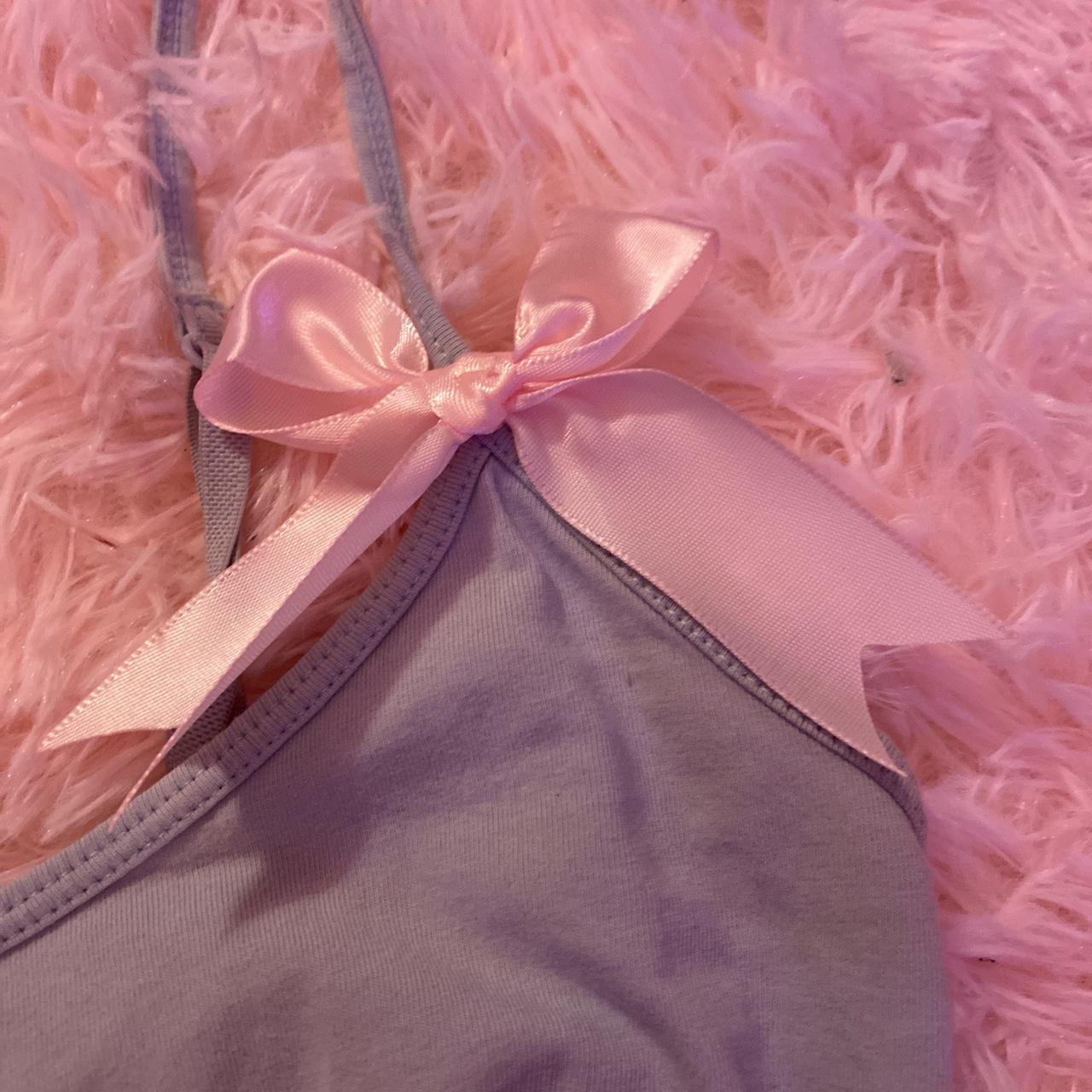 the cutest baby blue tank with baby pink bows... Depop