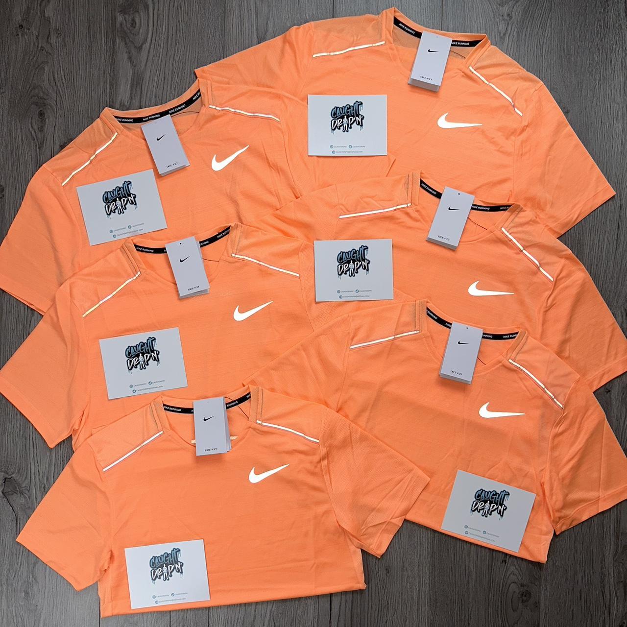 peach nike shirts