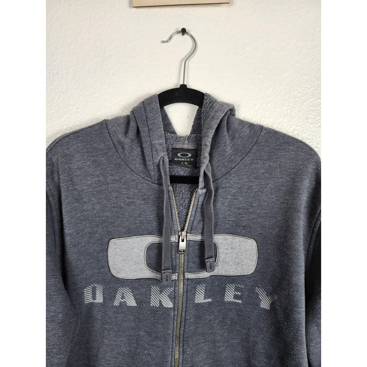 Oakley Zip Up Hooded Sweatshirt Size:... - Depop