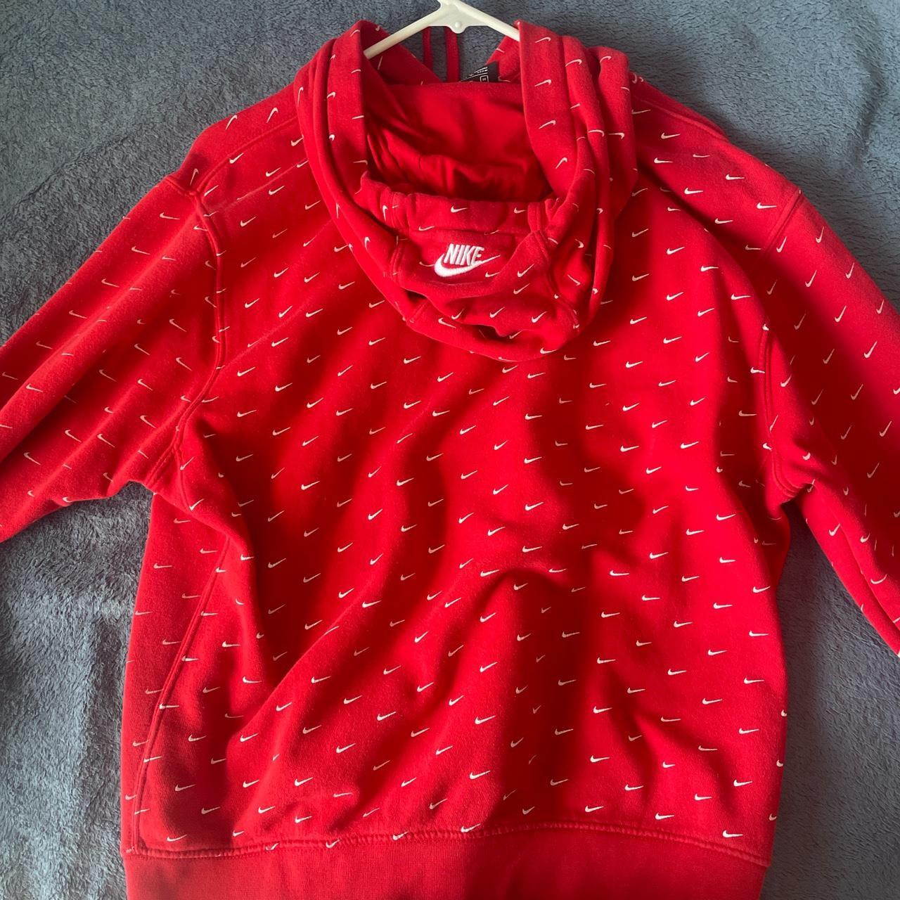 Red nike hoodie with white swoosh all over hot sale