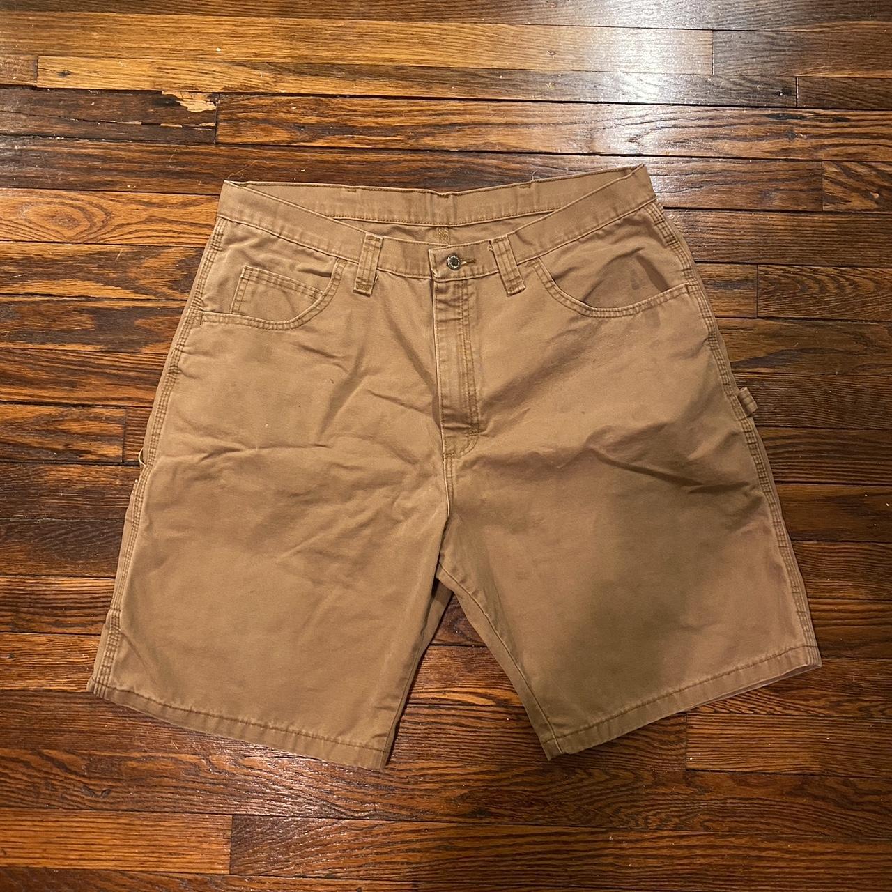 Brown wrangler carpenter jorts. size 38. they have a... - Depop