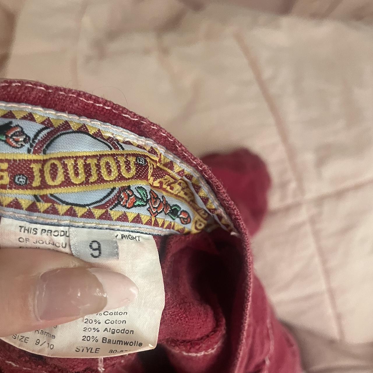 Vintage red shorts with white detailing Model has... Depop