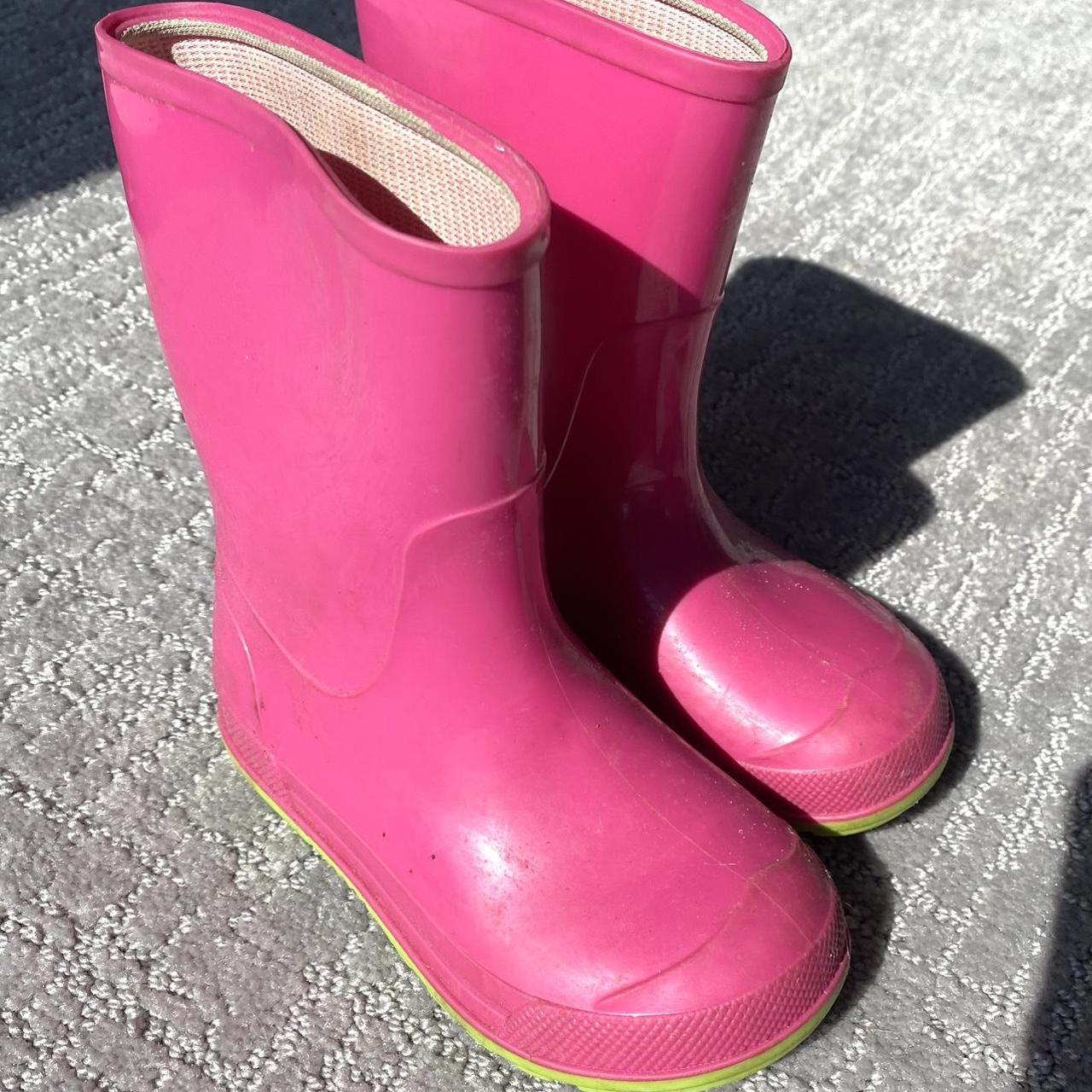 Pink and store green rain boots