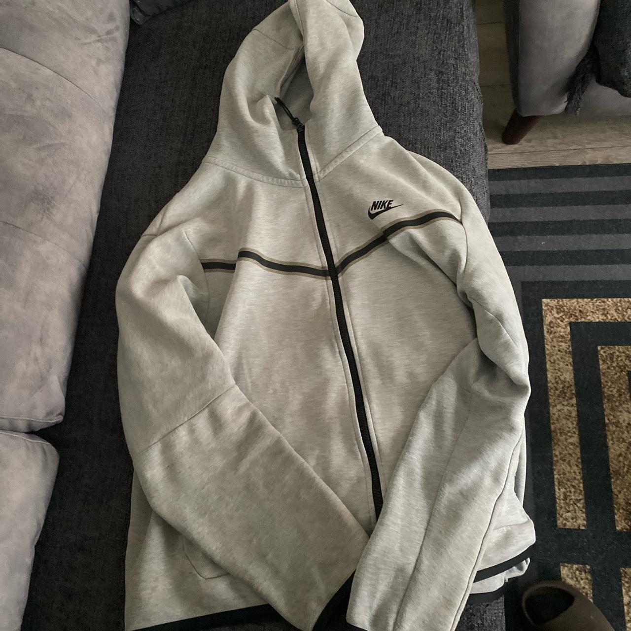 Nike tech grey hoodie has some minor stains on the... - Depop