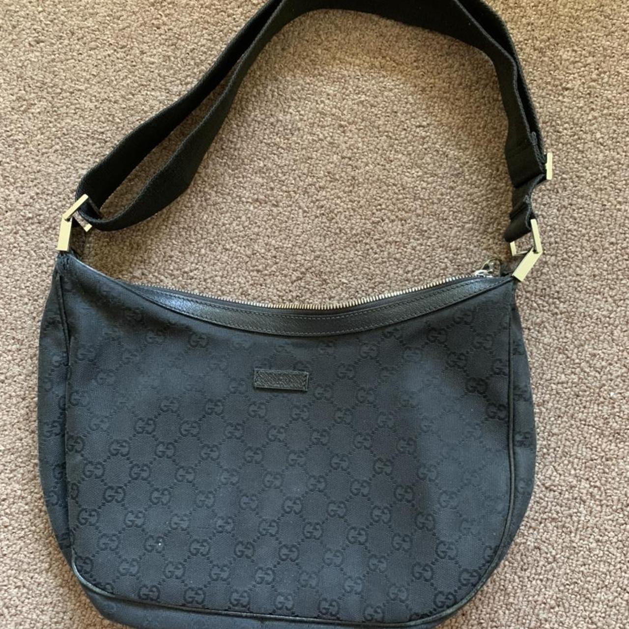 Gucci logo bag in black. Missing a tag on a zipper. - Depop