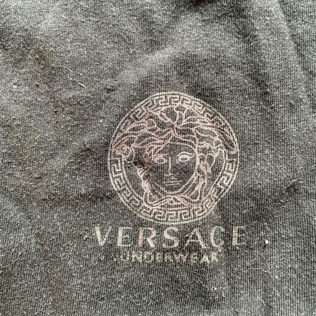 black versace t-shirt no size but fits a medium... - Depop