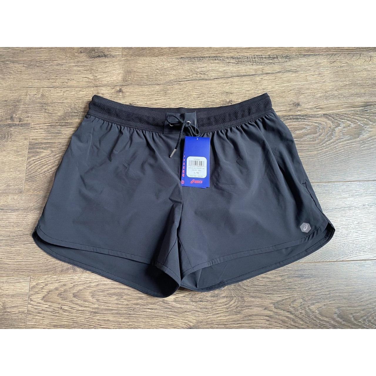 NWT Womens Asics woven slit short black D1 athletic. Depop