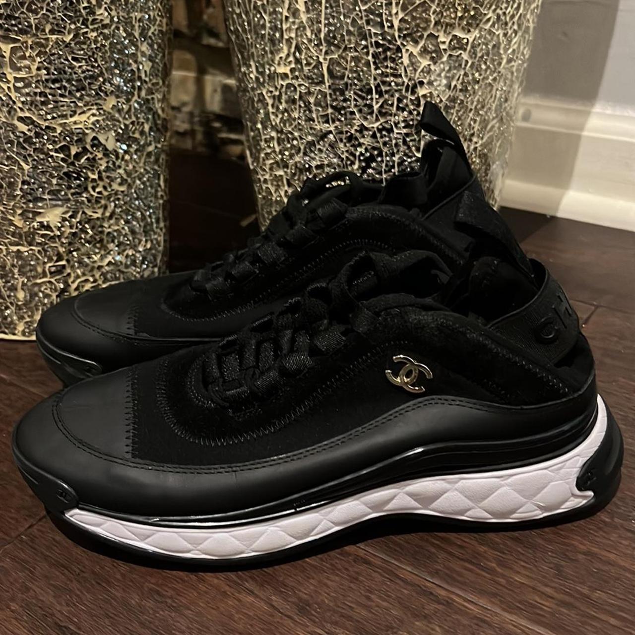 Chanel Women's Black and Gold Trainers | Depop