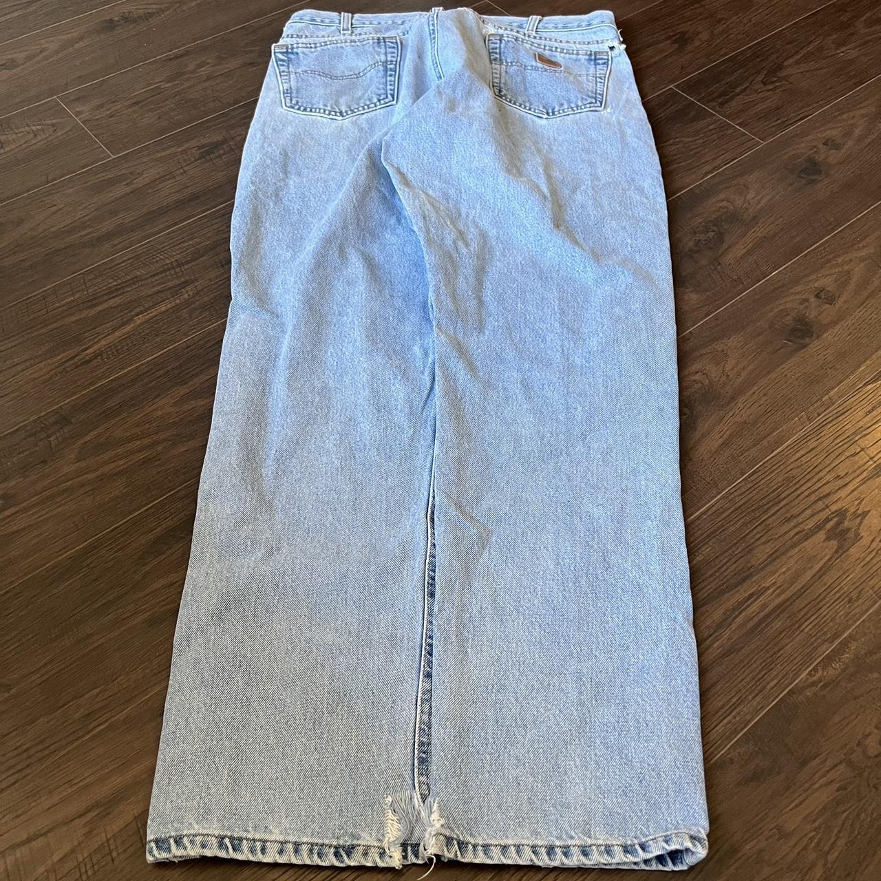 Distressed light wash carhartt jeans perfect for... - Depop