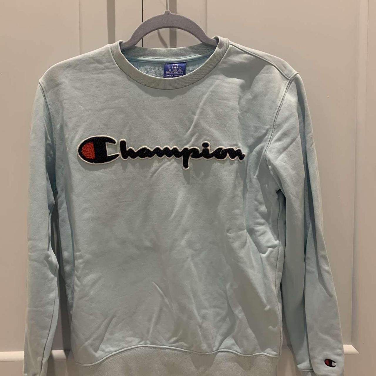 Champion light blue sweatshirt. Super nice fit and... - Depop