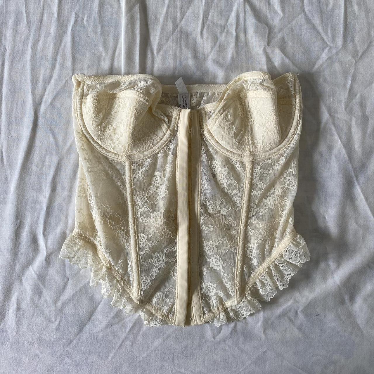 Urban Outfitters cream lace corset top Size 32B,... Depop